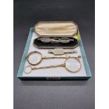 A pair of Georgian silver spectacles, in associated beadwork case; together with three pairs of gilt