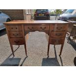 An inlaid mahogany desk, 80cm high x 121cm wide.