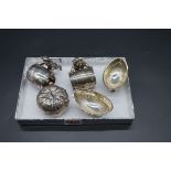 A small group of silver plate, to include a novelty pair of sailor and barrel napkin rings. (5)