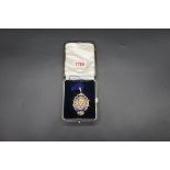 A circa 1930 silver gilt and enamel 'Nottingham & District Butcher's Association' neck badge, 6cm