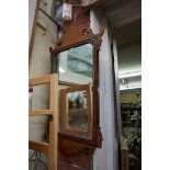 An 18th century style walnut fret frame wall mirror, 75 x 42.5cm.