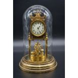 A German brass 400 day timepiece, with glass dome, 28cm high.
