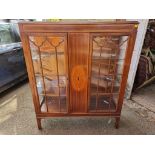 An Edwardian mahogany and inlaid bookcase, 128cm high x 107cm wide.