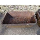 A pair of cast iron rectangular planters, 65cm wide; together with another circular example. (3)