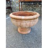 A terracotta garden urn, 55cm wide.