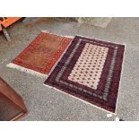 A modern Bokhara rug, 167cm x 125cm; together with another rug.