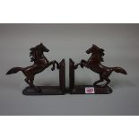 A pair of bronze horse bookends, 20cm wide.