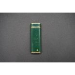 A vintage Cartier gilt and green lacquer lighter, 7cm high.
