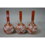 A set of three Japanese Kutani bottle vases, 24cm high.