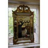 A 19th century giltwood framed wall mirror, 142 x 82cm.