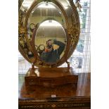 A George III mahogany and crossbanded toilet mirror, 45.5cm wide.