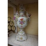 A large Dresden porcelain twin handled urn, cover and stand, 50cm high.