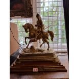 A large and impressive gilt brass knight on horseback, in the Renaissance style, on walnut base,