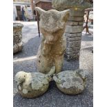 A composition stone seated cat; together with a small pair of composition stone birds.