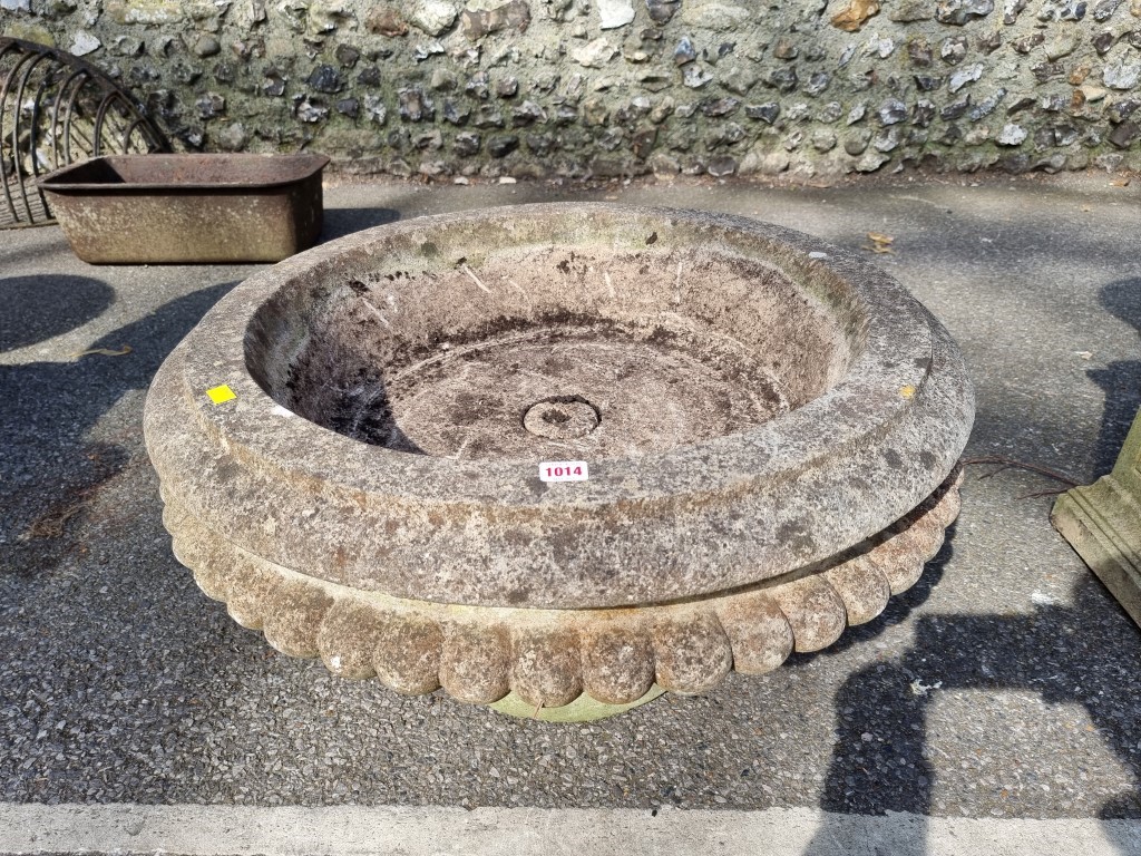 A large round circular stone planter on stand, 73cm wide.