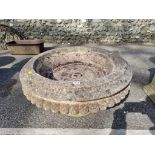 A large round circular stone planter on stand, 73cm wide.