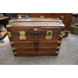 An old pine and brass bound dome top trunk, 77cm wide.