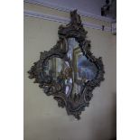 A good 18th century Italian painted and parcel gilt rococo wall mirror, 102 x 76cm.