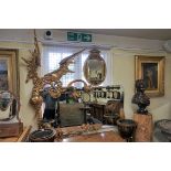 A large and impressive antique carved giltwood 'dragon' mirror, in the manner of Gabriel Viardot,