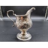 A George III silver cream jug, marks rubbed, 10.5cm, 116g.