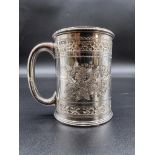 An Edwardian chased silver Christening mug, by Mappin & Webb, Sheffield 1908, 8cm high, 161g.