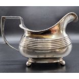 A George III silver milk jug, maker's mark rubbed, London 1812, 8.5cm high, 132g