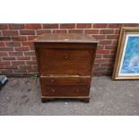 An antique oak commode, 75cm high x 59cm wide.