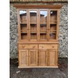 An old pine bookcase, 216cm high x 148cm wide x 47cm deep.