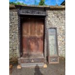 An antique continental oak two door cupboard, having a pair of glazed doors, 230cm high x 111.5cm
