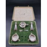 A cased silver five piece cruet set, by The Goldsmiths & Silversmiths Company, London 1934, 380g/