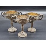 Three similar Chinese white metal twin handled pedestal cups, by Tuck Chang, Shanghai, two relating