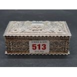 A metal rectangular casket, having chased scroll and floral decoration, 11cm wide.