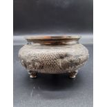 A Chinese white metal tripod censer, decorated with figures and buildings, no makers mark, 9cm diam