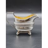 A George III silver milk jug, by IW?, London 1816, 9.5cm high, 165g.