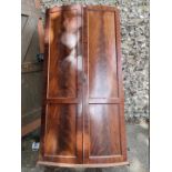 An antique mahogany bowfront wardrobe, (a.f.), 92cm wide x 180cm high x 50cm deep.