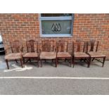 A set of six antique mahogany dining chairs; to include a pair of carvers.