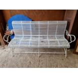 A white painted wrought iron garden bench, 177cm wide x 52cm deep.