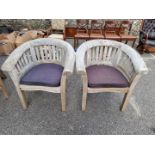 A pair of large teak 'Lindsey' tub chairs, 83cm wide x 88cm high.