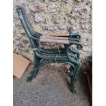 Two pairs of green painted metal bench ends, 84cm high.