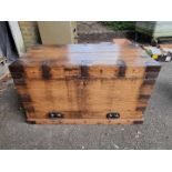 A large oak and metal bound trunk, 96.5cm wide x 60cm high x 59cm deep.