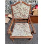 An antique armchair, with tapestry seat.