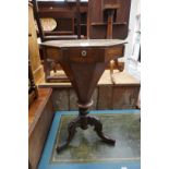A Victorian walnut and chequer board inlaid octagonal trumpet form work table; together with a