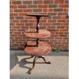 A George III mahogany dumbwaiter, 110cm high.