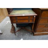 A small reproduction mahogany and leather top two drawer side table, 55.5cm wide.