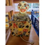 Jack in the Box: an early 20th century clown in decorated card box.