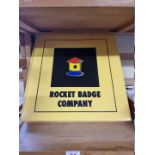 Rocket Badge Company: a product sample box, containing 25 pin badges in various finishes, cufflinks,