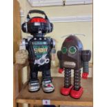 Robots: a vintage battery operated Thunder robot; together with a 1980s 'Strobot' (lacking gun).