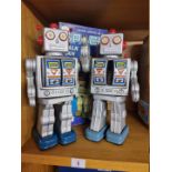 Robots: two vintage battery operated 'Space Walk Man' robots, with one original box.