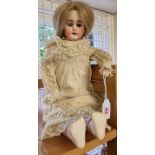 Dolls: an antique 17" bisque shoulder head doll, impressed to back 309 7, kid body with sleeping