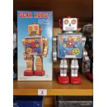 Robots: a vintage battery operated Made In Japan 'Gear' robot with original box.